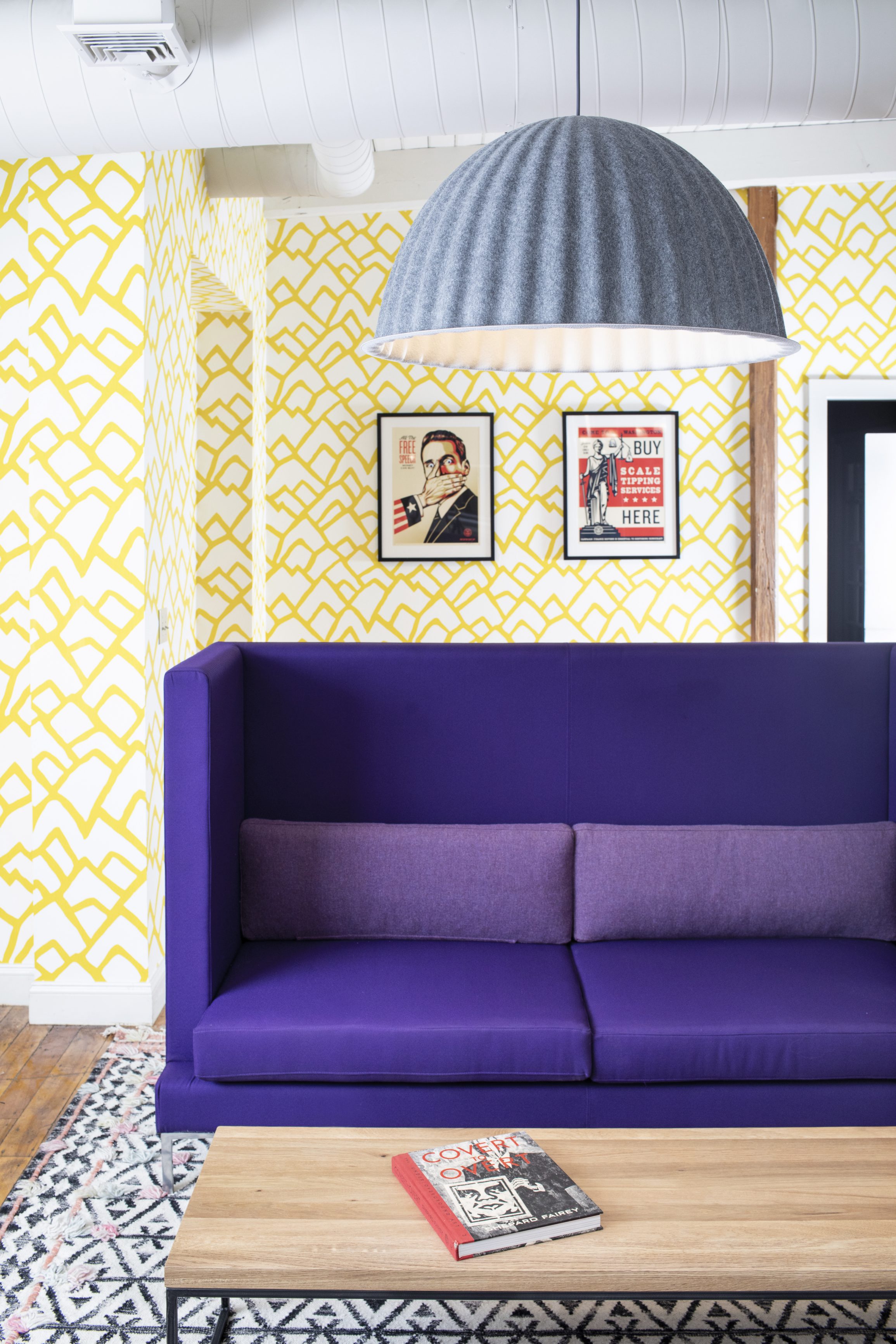 Yellow wallpaper and purple couch