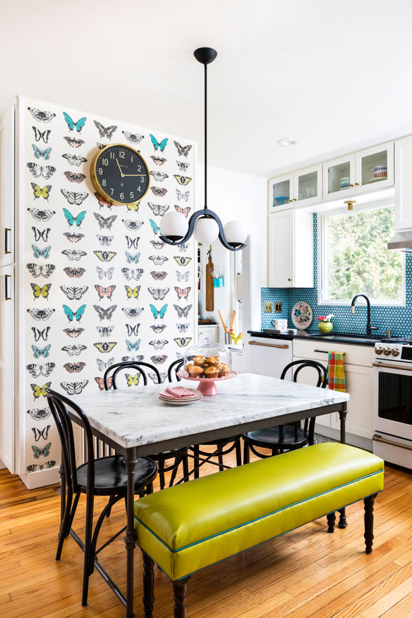 Green leather bench and butterfly wallpaper