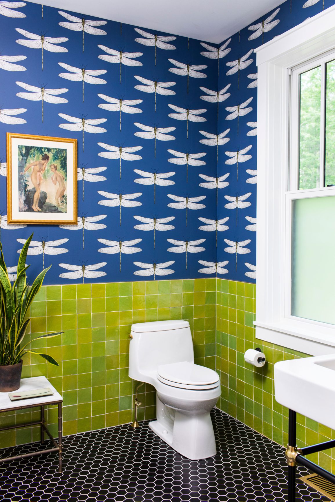 Dragonfly wallpaper and leaf green tile in bathroom