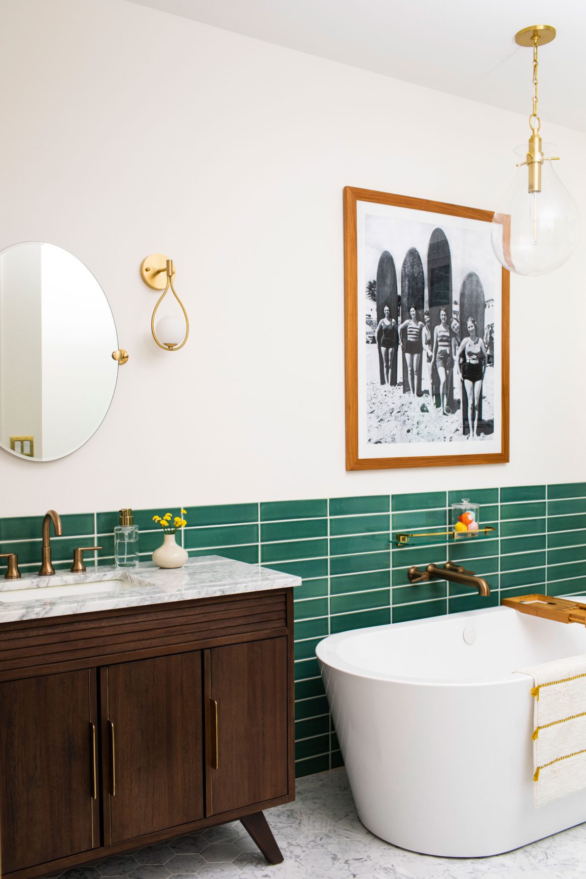 Green tiled bathroom with soaking tub