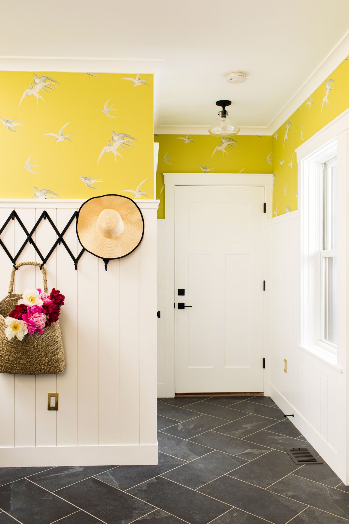 Mudroom with yellow bird wallpaper